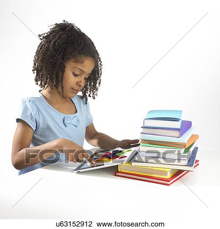 Girl using tablet computer View Large Photo Image Stock Image - Girl using tablet computer. Fotosearch