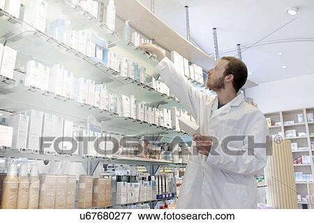 Pharmacist selecting drugs View Large Photo Image Stock Photo - Pharmacist selecting drugs. Fotosearch