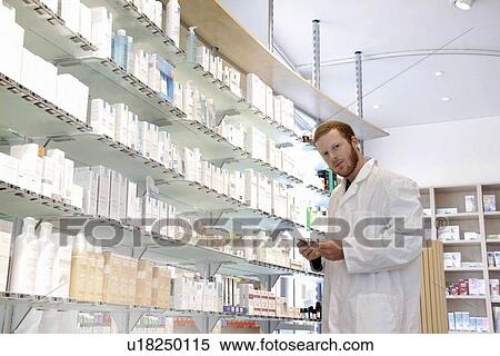 Stock Photography - Pharmacist selecting drugs. Fotosearch