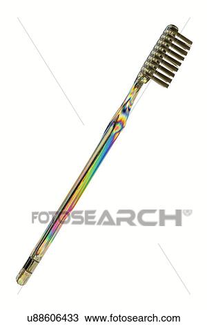 Stock Image - Photoelastic stress of toothbrush. Fotosearch