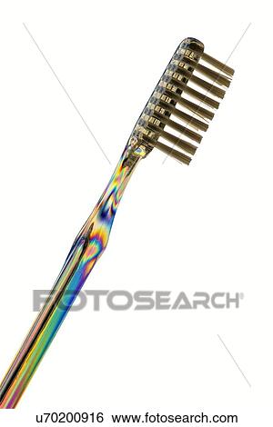 Stock Photograph - Photoelastic stress of toothbrush. Fotosearch