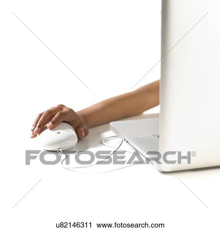 Young girl using a laptop View Large Photo Image Stock Image - Young girl using a laptop. Fotosearch