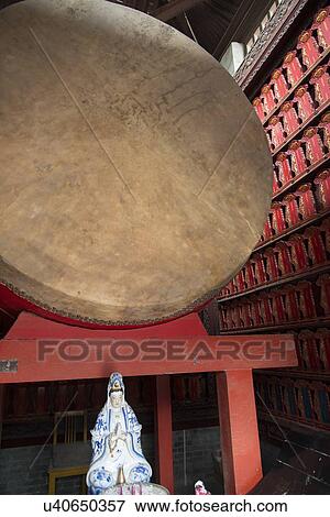 Stock Photo - Ancient drum and religious statue at Giant Wild Goose Pagoda, Xi'an, Shaanxi, China.. Fotosearch