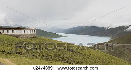Building along Yamdrok Lake, Nagarze, Shannan, Tibet, China View Large Photo Image Stock Image - Building along Yamdrok Lake, Nagarze, Shannan, Tibet, China. Fotosearch