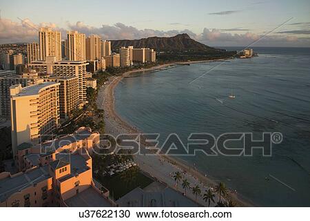 Stock Image - Buildings along beachfront, Waikiki, Honolulu, Oahu, Hawaii, USA. Fotosearch