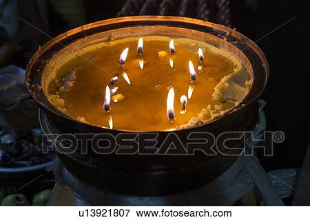 Stock Photo - Burning candles in Ani Tsangkung Nunnery, Barkhor, Lhasa, Tibet, China. Fotosearch