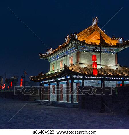 Chinese lanterns and illuminated building at Xi'an, Shaanxi, China. View Large Photo Image Stock Photo - Chinese lanterns and illuminated building at Xi'an, Shaanxi, China.. Fotosearch