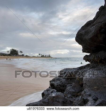 Cliff on the beach with surf in the background, Sandy Beach, Hawaii Kai, Honolulu, Oahu, Hawaii, USA View Large Photo Image Stock Image - Cliff on the beach with surf in the background, Sandy Beach, Hawaii Kai, Honolulu, Oahu, Hawaii, USA. Fotosearch
