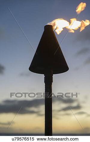 Stock Photography - Close-up of a flaming torch, Waikiki, Honolulu, Oahu, Hawaii, USA. Fotosearch