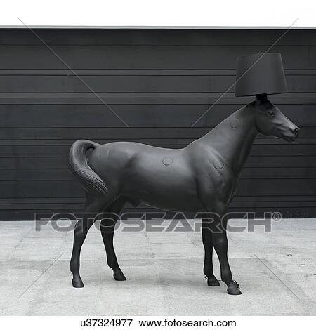 Stock Photo - Horse statue with lampshade on head at Westin Hotel, Xian, Shaanxi, China.. Fotosearch