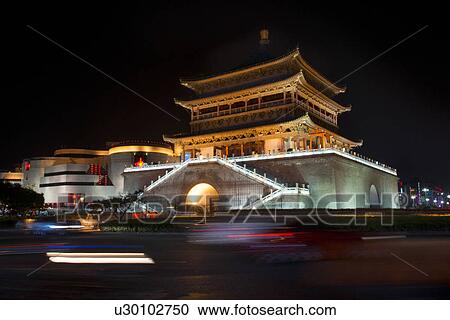 Stock Image - Illuminated Bell Tower at night, Xi'an, Shaanxi, China.. Fotosearch