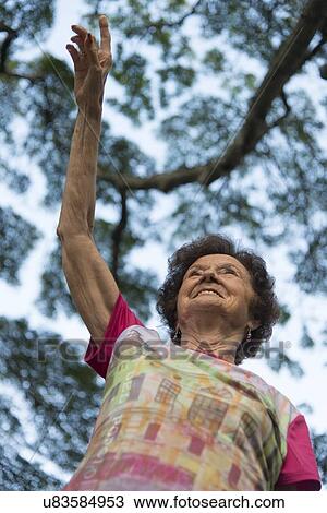 Low angle view of a woman pointing away, Haleiwa, North Shore, Oahu, Hawaii, USA View Large Photo Image Stock Image - Low angle view of a woman pointing away, Haleiwa, North Shore, Oahu, Hawaii, USA. Fotosearch