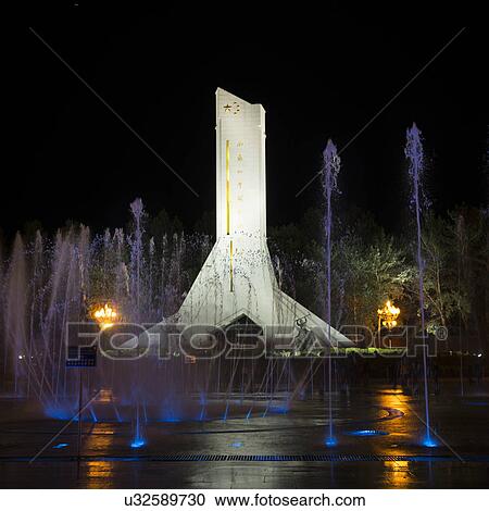 Stock Image - Monument to the Peaceful Liberation of Tibet at night, Potala Palace Square, Lhasa, Tibet, China. Fotosearch