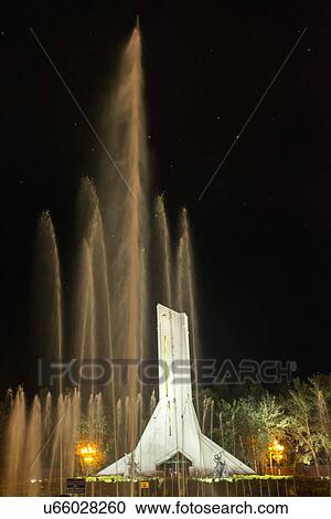 Stock Image - Monument to the Peaceful Liberation of Tibet at night, Potala Palace Square, Lhasa, Tibet, China. Fotosearch