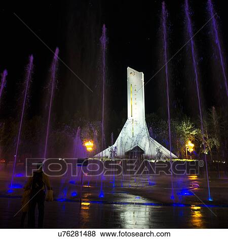 Stock Photo - Monument to the Peaceful Liberation of Tibet at night, Potala Palace Square, Lhasa, Tibet, China. Fotosearch