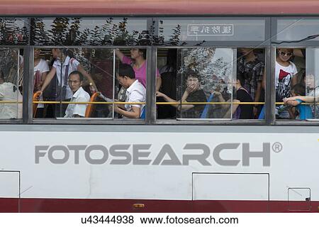 Stock Photo - Passengers travelling in a bus, Xi'an, Shaanxi, China.. Fotosearch
