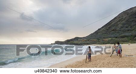 People enjoying the beach, Sandy Beach, Hawaii Kai, Honolulu, Oahu, Hawaii, USA View Large Photo Image Stock Image - People enjoying the beach, Sandy Beach, Hawaii Kai, Honolulu, Oahu, Hawaii, USA. Fotosearch
