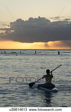 People enjoying the ocean, Waikiki, Honolulu, Oahu, Hawaii, USA View Large Photo Image Stock Image - People enjoying the ocean, Waikiki, Honolulu, Oahu, Hawaii, USA. Fotosearch