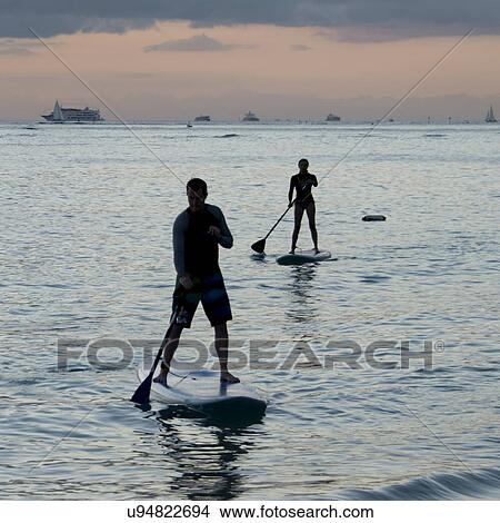 Picture - People paddleboarding in the ocean, Waikiki, Honolulu, Oahu, Hawaii, USA. Fotosearch