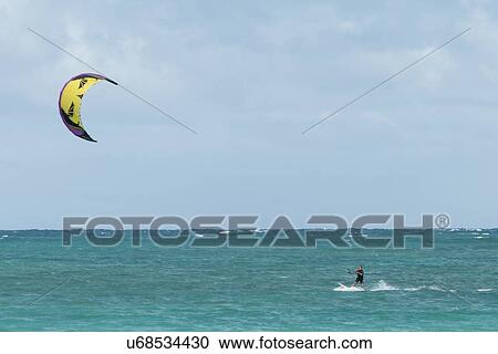 Stock Image - Person kiteboarding in the ocean, Kailua Beach, Kailua, Oahu, Hawaii, USA. Fotosearch