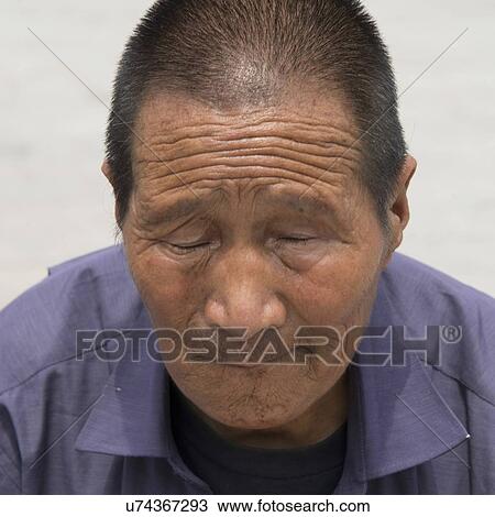 Portrait of a senior man with eyes closed, Xi'an, Shaanxi, China. View Large Photo Image Stock Image - Portrait of a senior man with eyes closed, Xi'an, Shaanxi, China.. Fotosearch