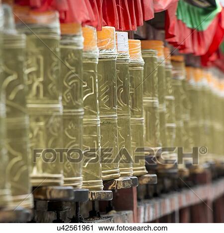 Stock Image - Prayer wheels in Potala Palace, Lhasa, Tibet, China. Fotosearch