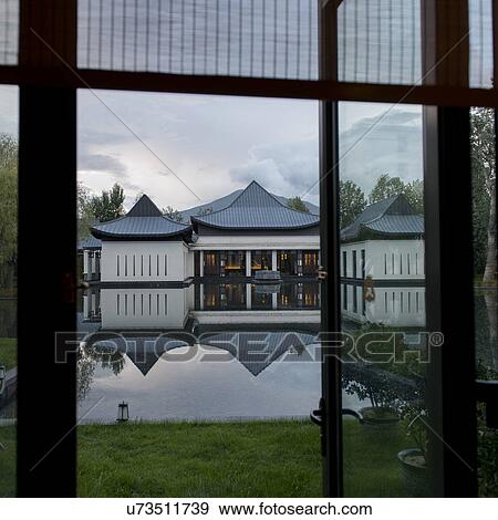 Reflection of St. Regis Hotel in water, Lhasa, Tibet, China View Large Photo Image Stock Photo - Reflection of St. Regis Hotel in water, Lhasa, Tibet, China. Fotosearch