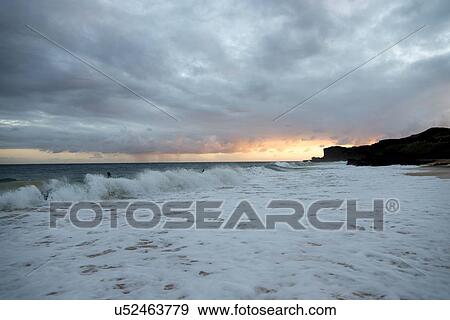 Surf on the beach at sunset, Sandy Beach, Hawaii Kai, Honolulu, Oahu, Hawaii, USA View Large Photo Image Stock Photo - Surf on the beach at sunset, Sandy Beach, Hawaii Kai, Honolulu, Oahu, Hawaii, USA. Fotosearch