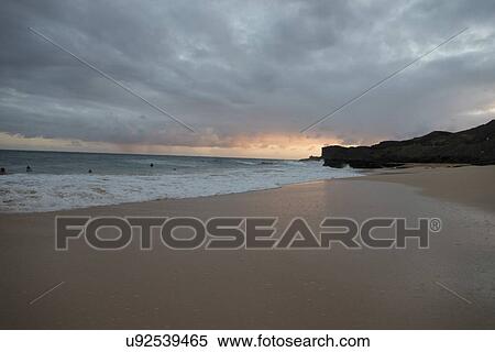 Surf on the beach at sunset, Sandy Beach, Hawaii Kai, Honolulu, Oahu, Hawaii, USA View Large Photo Image Stock Photography - Surf on the beach at sunset, Sandy Beach, Hawaii Kai, Honolulu, Oahu, Hawaii, USA. Fotosearch
