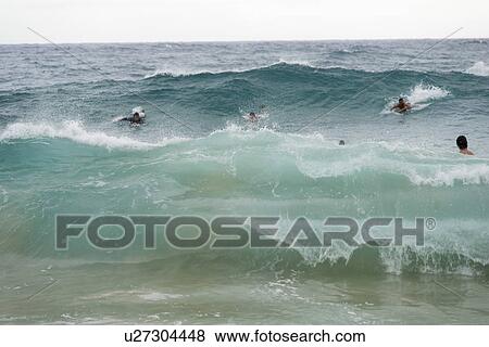 Stock Photo - Surfers at Sandy Beach, Hawaii Kai, Honolulu, Oahu, Hawaii, USA. Fotosearch