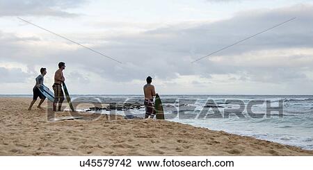 Surfers on the beach, Sandy Beach, Hawaii Kai, Honolulu, Oahu, Hawaii, USA View Large Photo Image Stock Image - Surfers on the beach, Sandy Beach, Hawaii Kai, Honolulu, Oahu, Hawaii, USA. Fotosearch