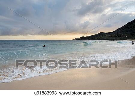 Surfers on the beach, Sandy Beach, Hawaii Kai, Honolulu, Oahu, Hawaii, USA View Large Photo Image Stock Image - Surfers on the beach, Sandy Beach, Hawaii Kai, Honolulu, Oahu, Hawaii, USA. Fotosearch