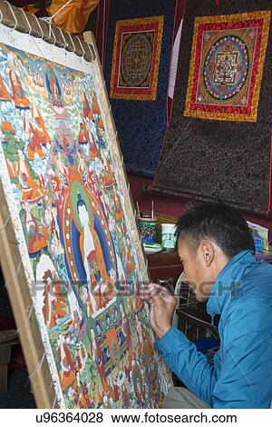 Stock Photo - Tibetan painter making a painting of Buddha, Barkhor, Lhasa, Tibet, China. Fotosearch