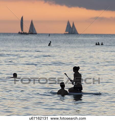 Tourists in the ocean, Waikiki, Honolulu, Oahu, Hawaii, USA View Large Photo Image Stock Image - Tourists in the ocean, Waikiki, Honolulu, Oahu, Hawaii, USA. Fotosearch