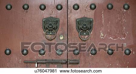 Stock Image - Traditional chinese door knocker, Xi'an, Shaanxi, China.. Fotosearch