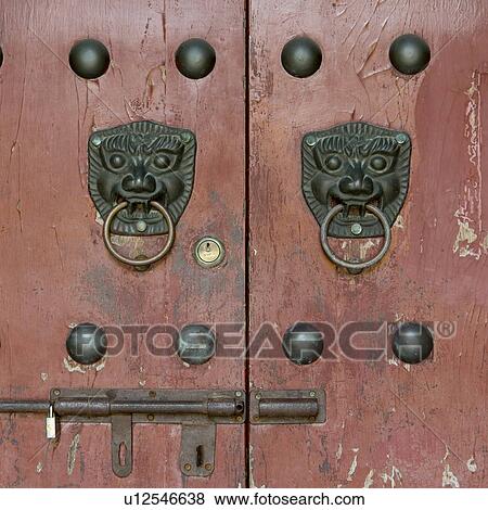 Stock Photo - Traditional lion head door knocker, Xi'an, Shaanxi, China.. Fotosearch