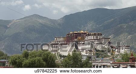 Stock Photography - View of the Potala Palace with mountains in the background, Lhasa, Tibet, China. Fotosearch