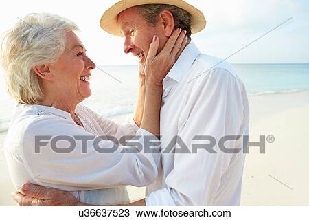 Affectionate Senior Couple On Tropical Beach Holiday View Large Photo Image Stock Image - Affectionate Senior Couple On Tropical Beach Holiday. Fotosearch