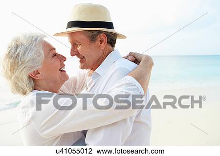 Affectionate Senior Couple On Tropical Beach Holiday View Large Photo Image Stock Image - Affectionate Senior Couple On Tropical Beach Holiday. Fotosearch
