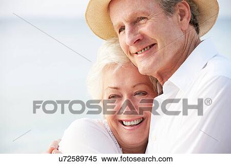 Affectionate Senior Couple On Tropical Beach Holiday View Large Photo Image Stock Photography - Affectionate Senior Couple On Tropical Beach Holiday. Fotosearch