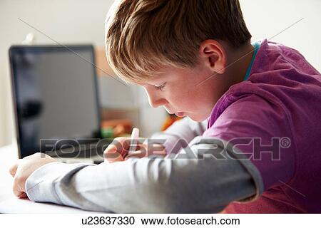 Boy Studying In Bedroom Using Laptop View Large Photo Image Stock Image - Boy Studying In Bedroom Using Laptop. Fotosearch