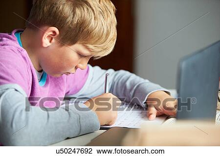 Boy Studying In Bedroom Using Laptop View Large Photo Image Stock Image - Boy Studying In Bedroom Using Laptop. Fotosearch