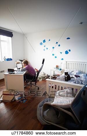 Boy Using Laptop In Bedroom View Large Photo Image Stock Image - Boy Using Laptop In Bedroom. Fotosearch