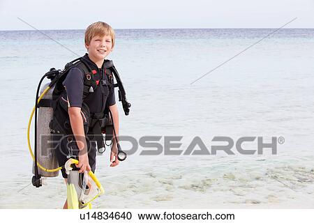 Boy With Scuba Diving Equipment Enjoying Beach Holiday View Large Photo Image Stock Image - Boy With Scuba Diving Equipment Enjoying Beach Holiday. Fotosearch