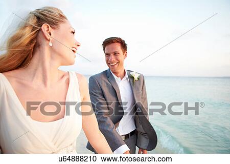 Bride And Groom Getting Married In Beach Ceremony View Large Photo Image Stock Image - Bride And Groom Getting Married In Beach Ceremony. Fotosearch