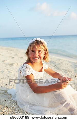 Bridesmaid Sitting On Beach At Wedding Ceremony View Large Photo Image Stock Photo - Bridesmaid Sitting On Beach At Wedding Ceremony. Fotosearch