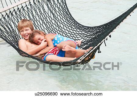 Brother And Sister Relaxing In Beach Hammock View Large Photo Image Stock Image - Brother And Sister Relaxing In Beach Hammock . Fotosearch
