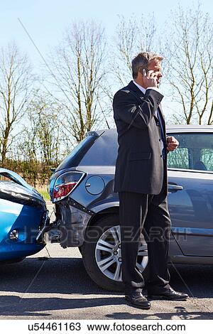 Businessman Making Phone Call After Traffic Accident View Large Photo Image Stock Image - Businessman Making Phone Call After Traffic Accident. Fotosearch
