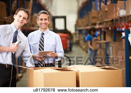 Stock Photo - Businessmen Checking Boxes With Digital Tablet And Scanner. Fotosearch