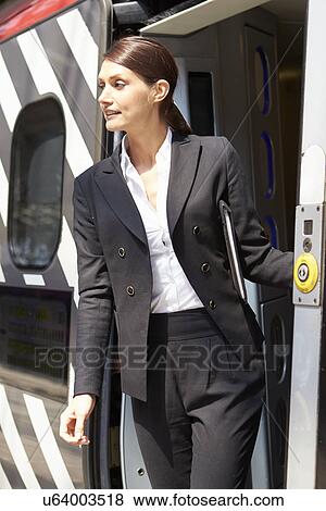Businesswoman Getting Off Train At Platform View Large Photo Image Stock Photo - Businesswoman Getting Off Train At Platform. Fotosearch